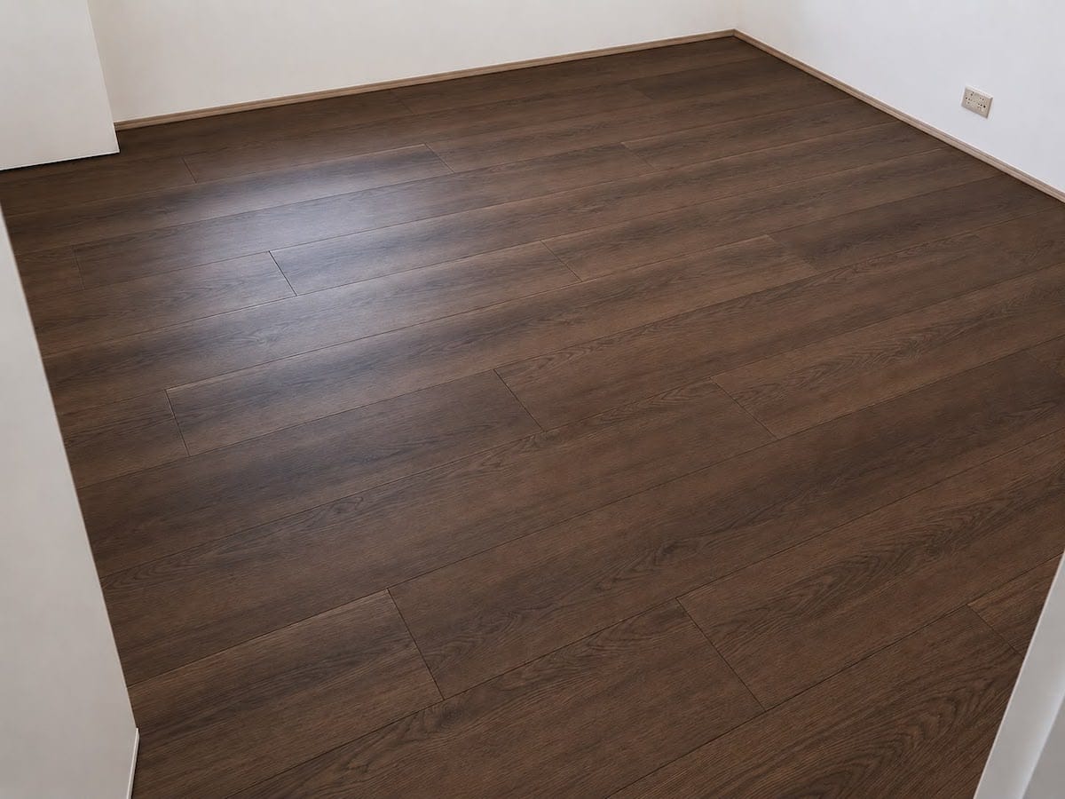 Dark brown SPC flooring installed in a bedroom in Dubai