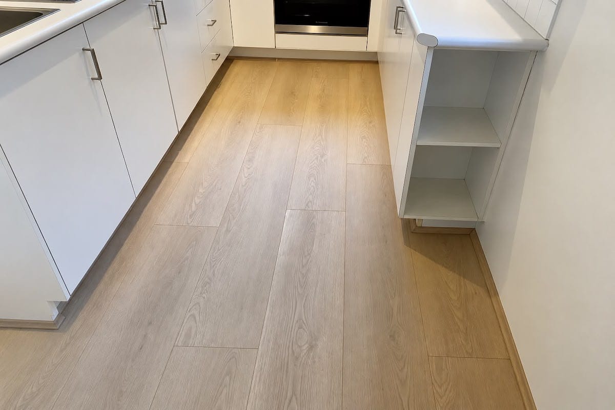 Light oak SPC flooring installed in a modern kitchen in Dubai
